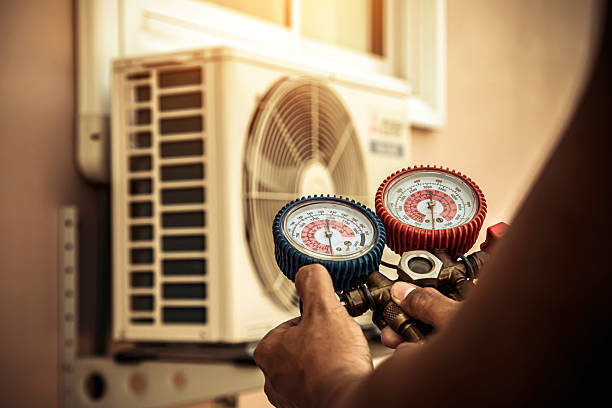 Professional Air Conditioning Service technician working in Whitsett, NC